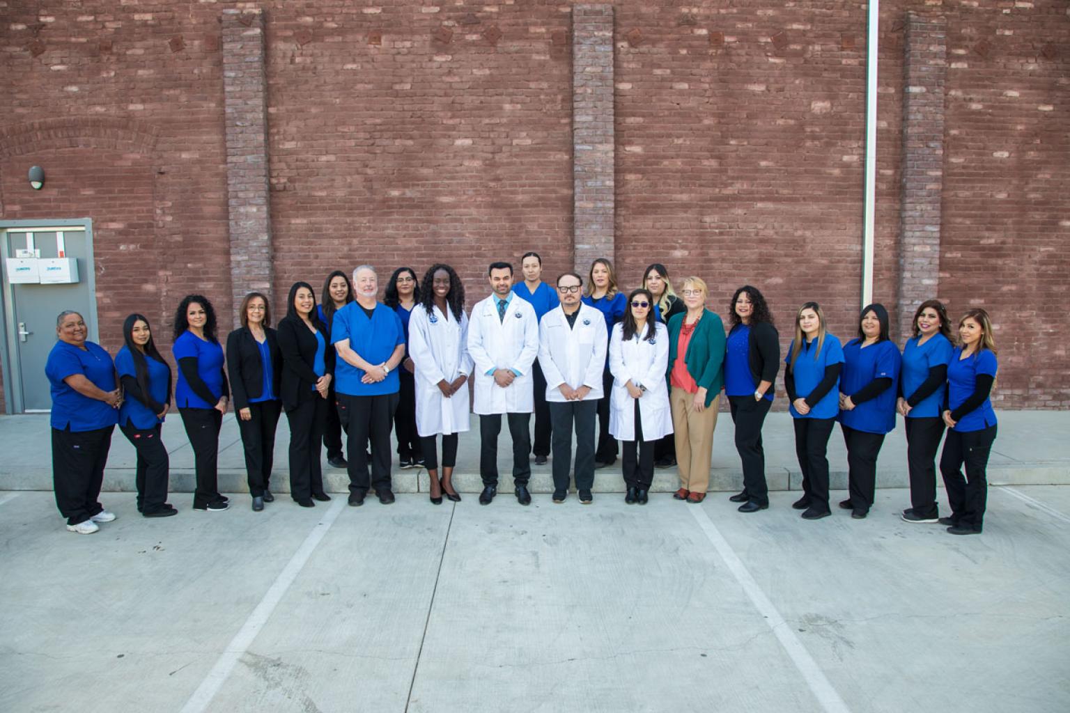 UHC Fowler Staff next to building 